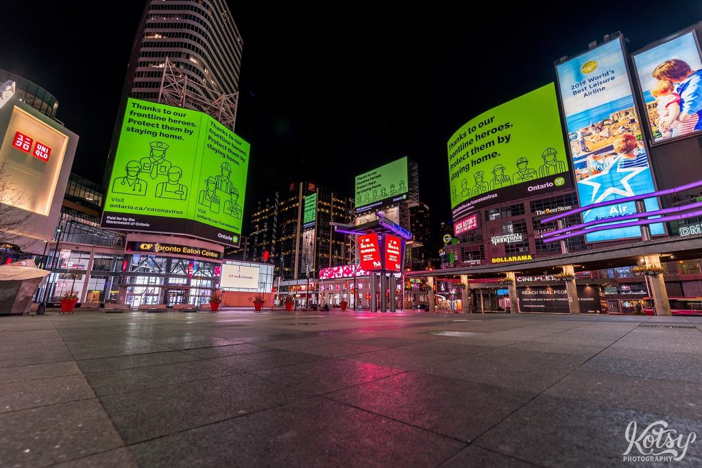 An empty Yonge-Dundas Square is seen with media screens showing thanks to frontline heroes during the Covid-19 pandemic in Toronto