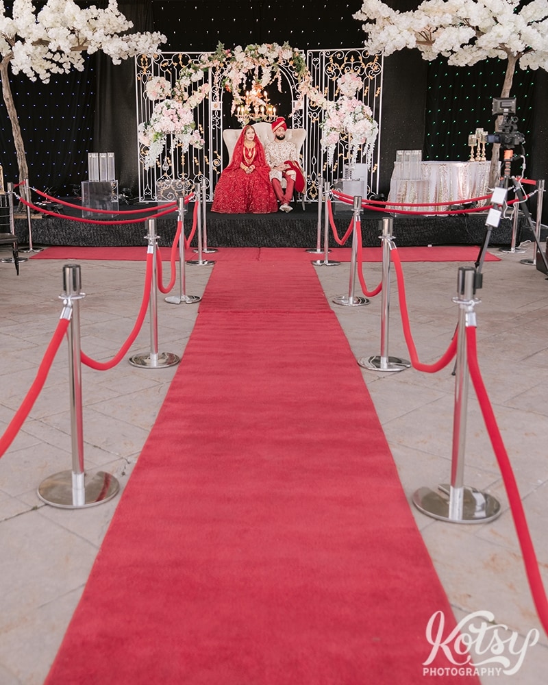 The look down the red carpeted aisle for a drive-thru wedding at the Pearson Convention Centre in Mississauga, Ontario