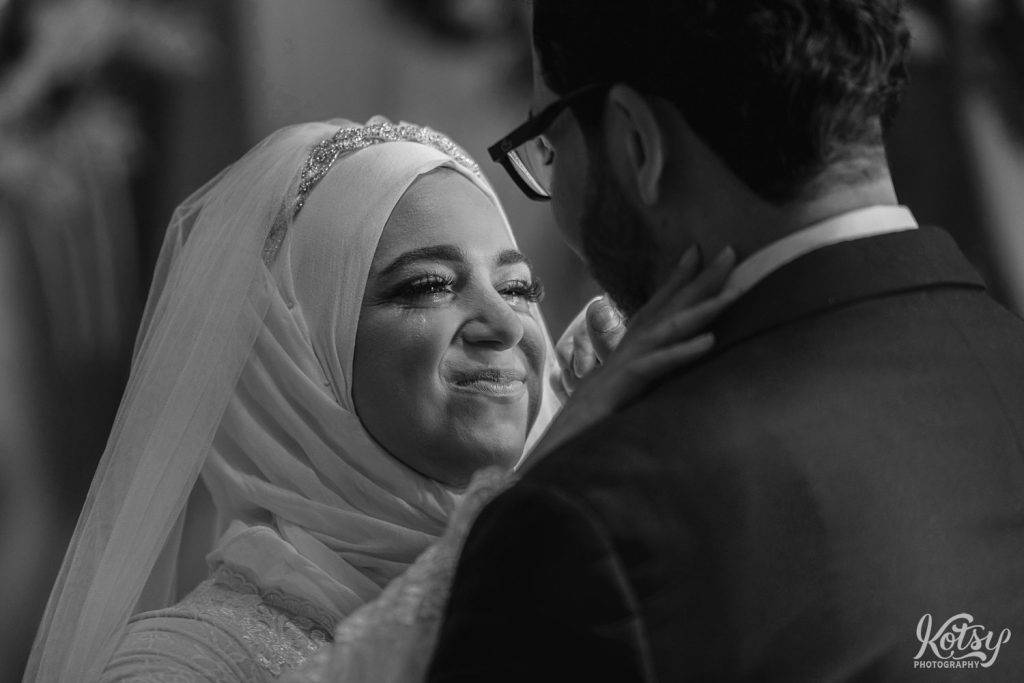 A bride sheds tears during the wedding reception first dance with her new husband in Toronto, Canada