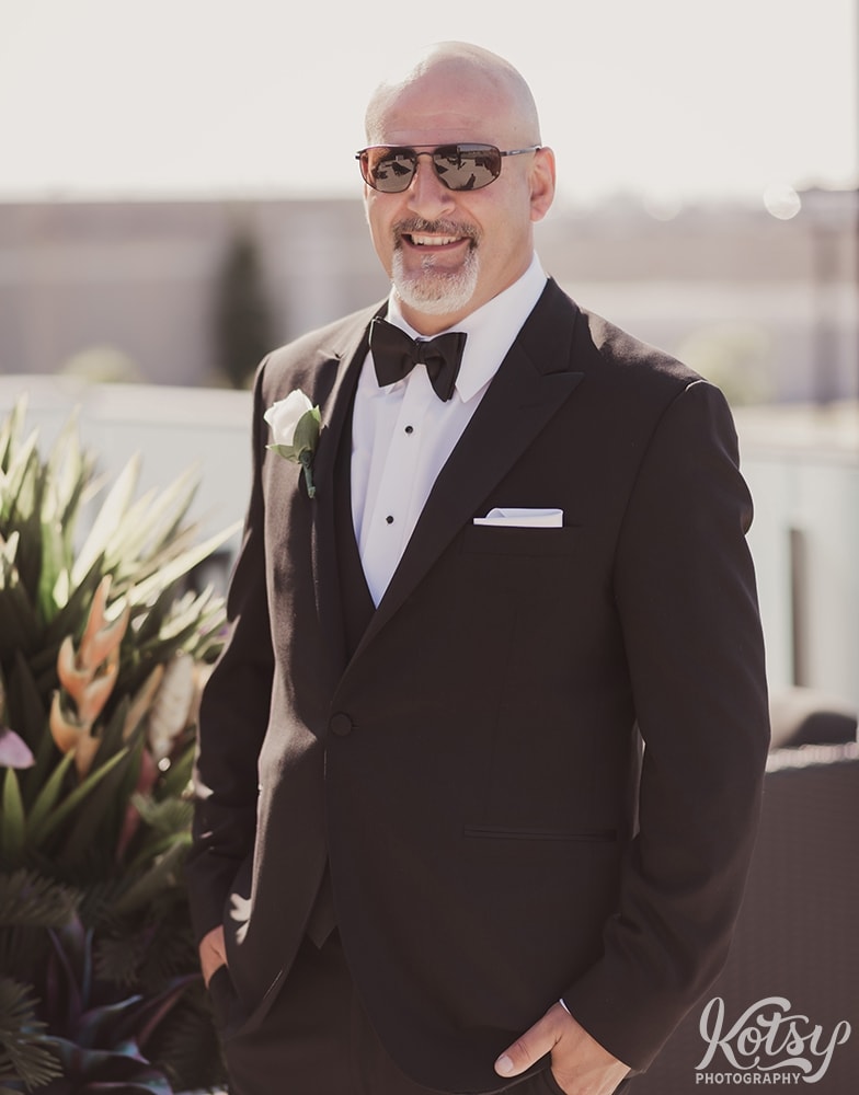 A groom poses in a tuxedo and sunglasses at Universal EventSpace in Vaughan