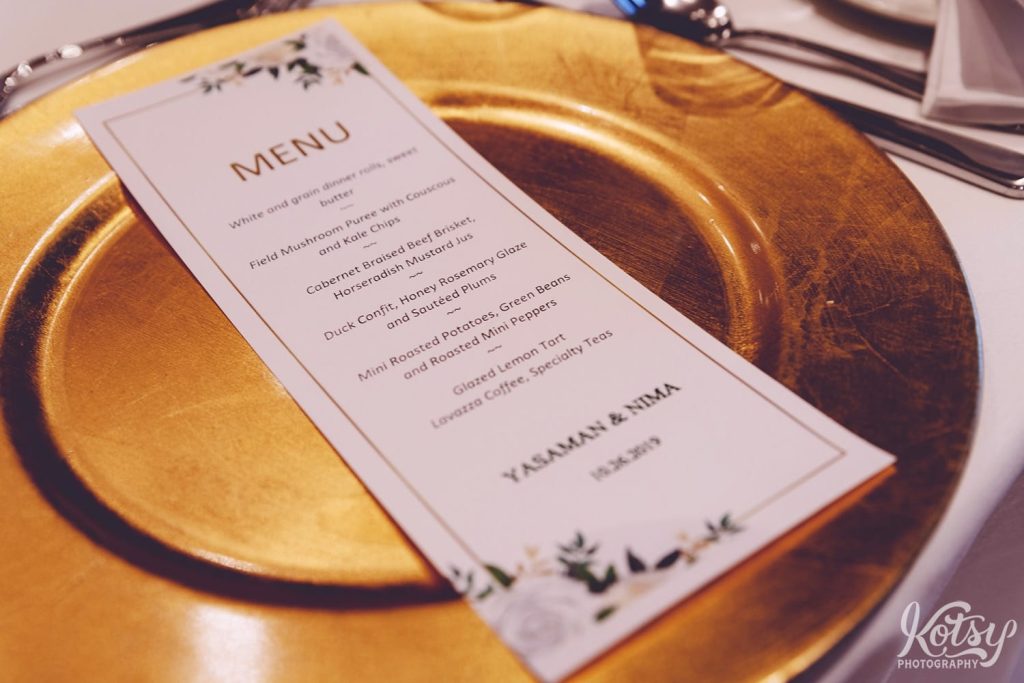 A close-up shot of a wedding reception dinner menu.