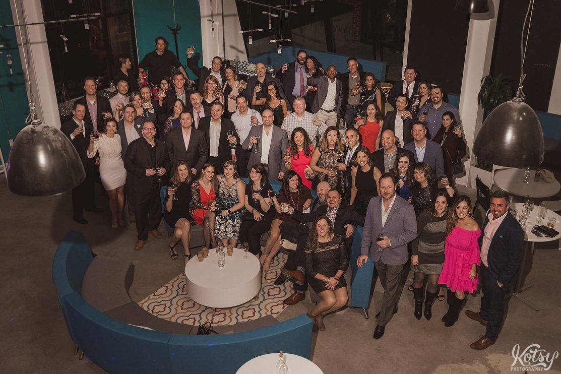A elevated shot of a large group of people at an engagement party in Toronto.