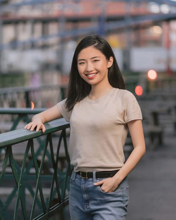 A woman poses for a portrait