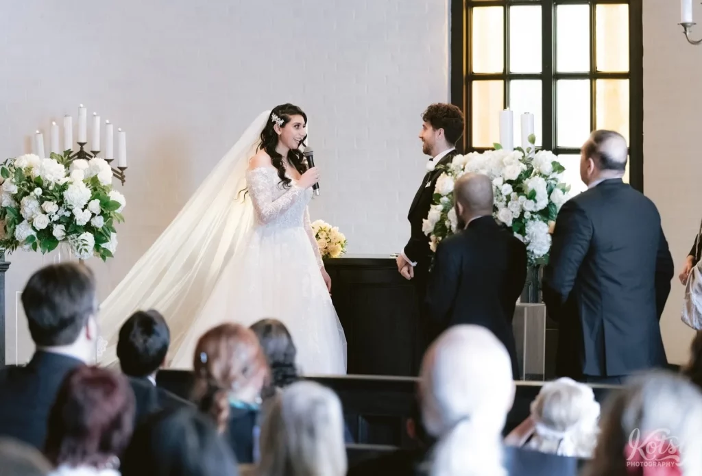 A bride delivers vows to her groom during their Old Mill wedding in Toronto