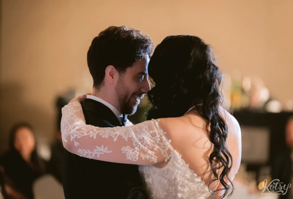 A close up shot of a bride and groom enjoying their first dance at Old Mill in Toronto