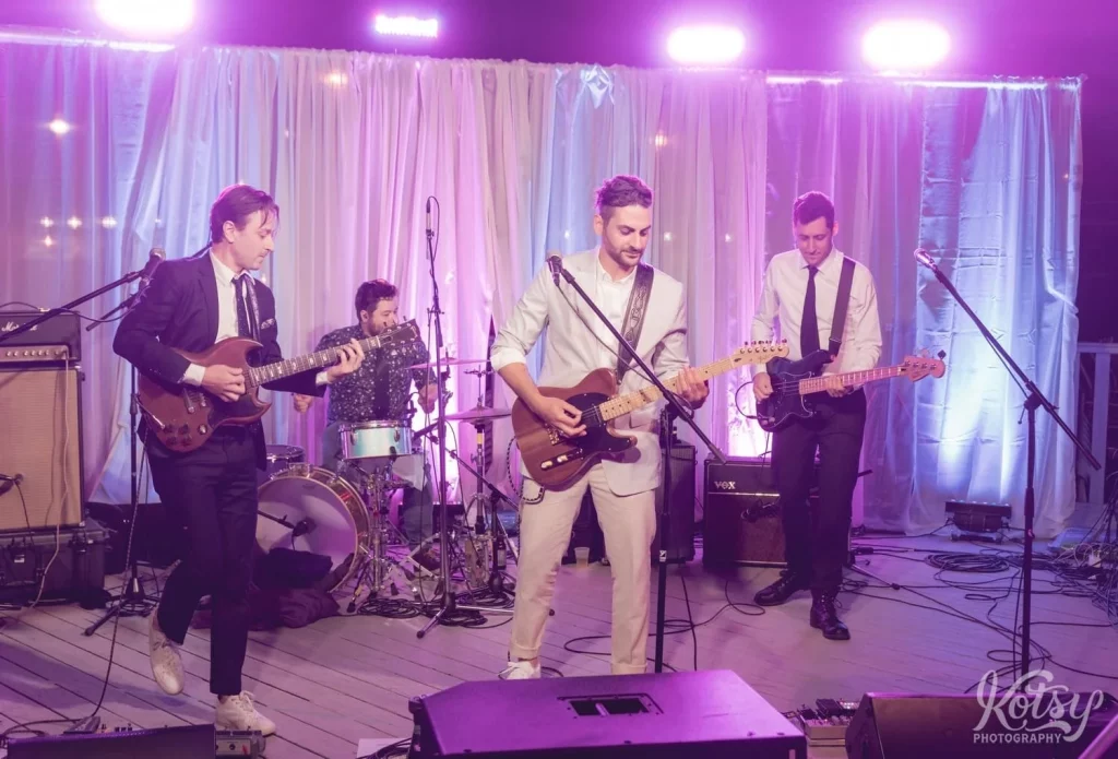 A 4 piece band perform at an outdoor wedding reception in Toronto