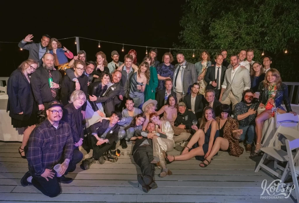 A large group shot on a patio during an outdoor wedding reception in Toronto