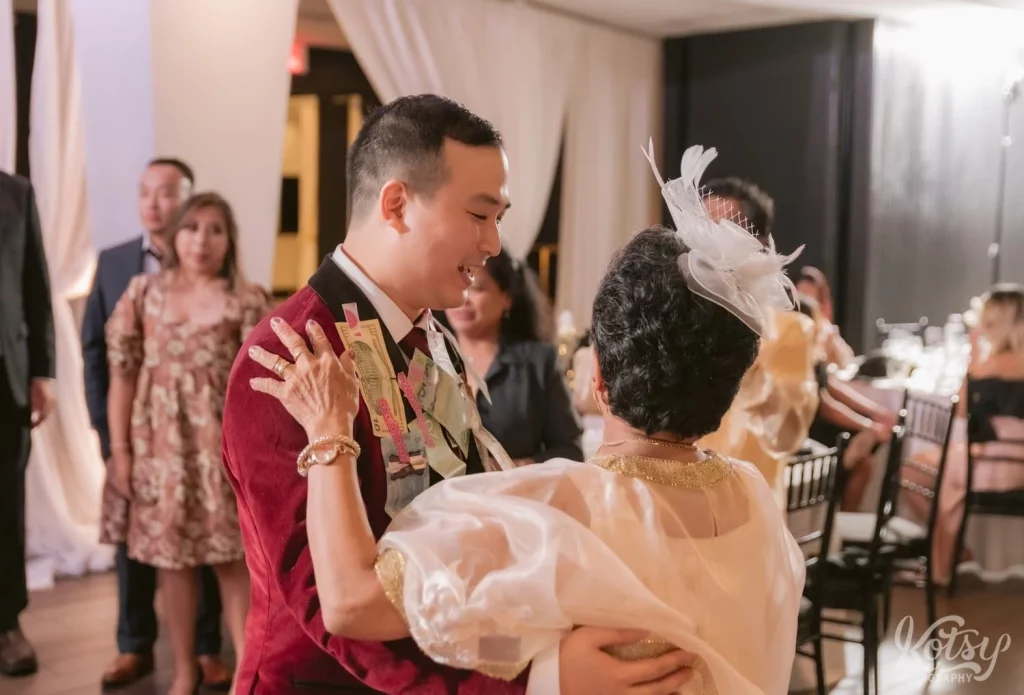 A groom enjoy a dance with his grandmother at his wedding reception at The Vue Event Venue in Toronto