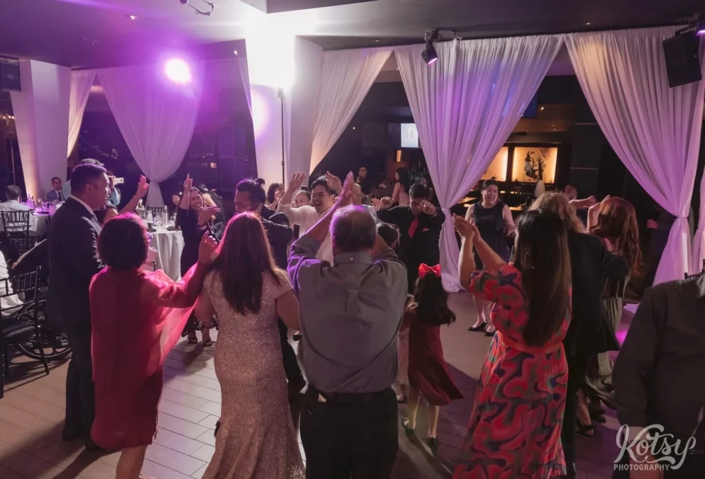 A large group dance at a wedding reception at the Vue Event Venue in Toronto
