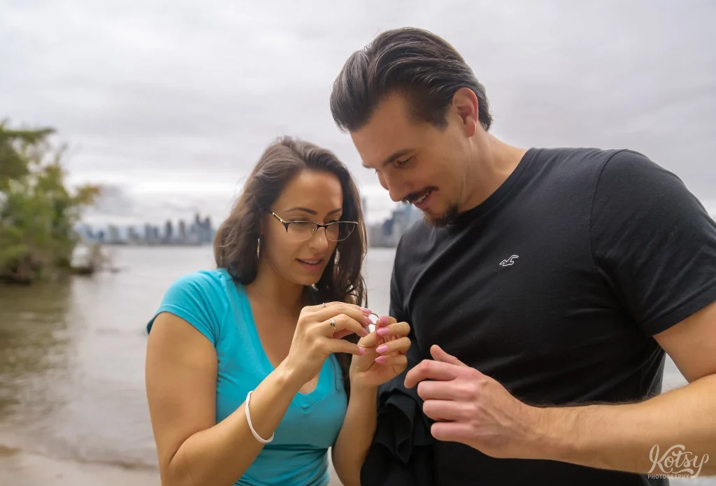 A couple looks at an engagement ring on Toronto Islands