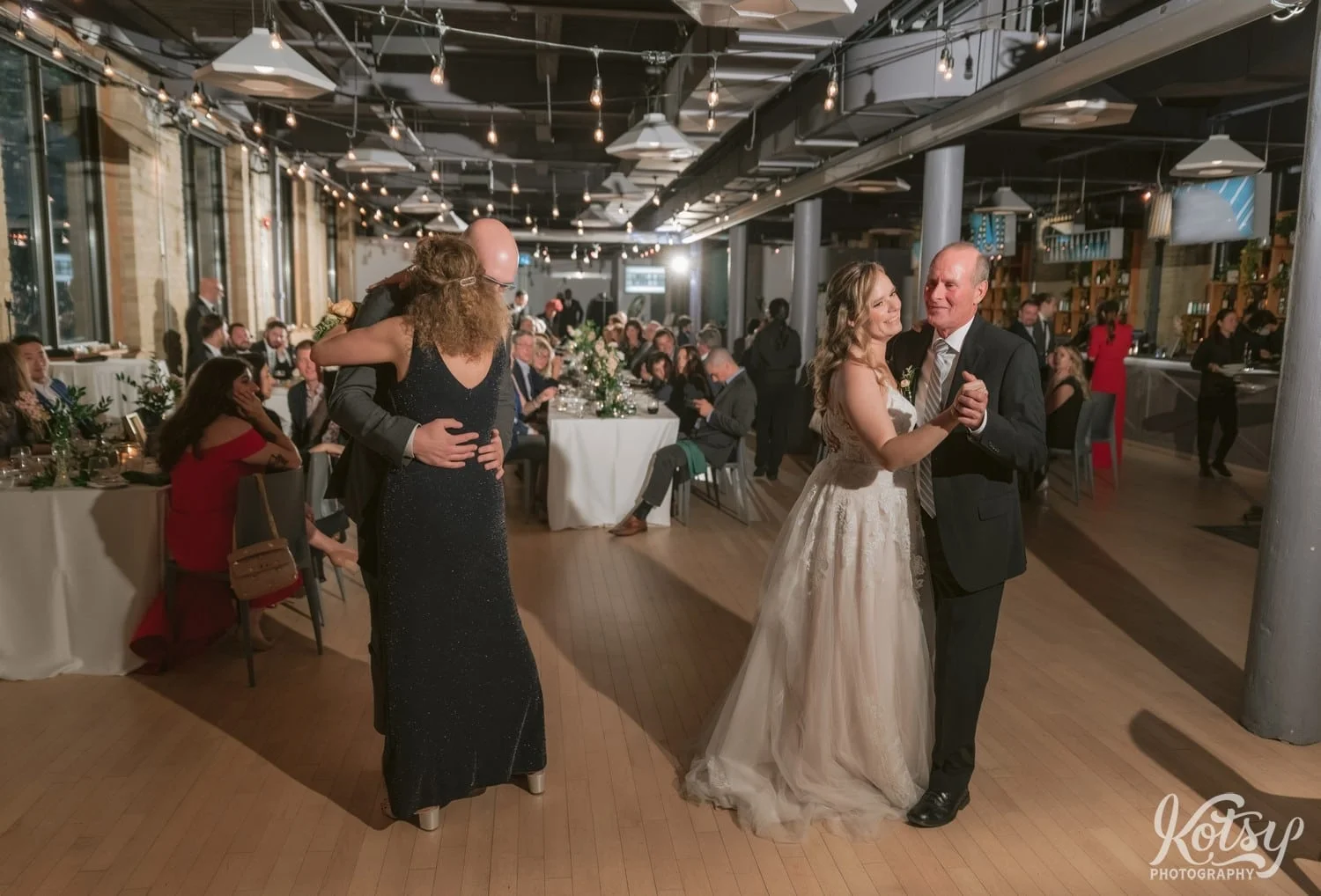 A bride and groom enjoy a dance with their father and mother during Second Floor Events wedding reception in Toronto, Canada.