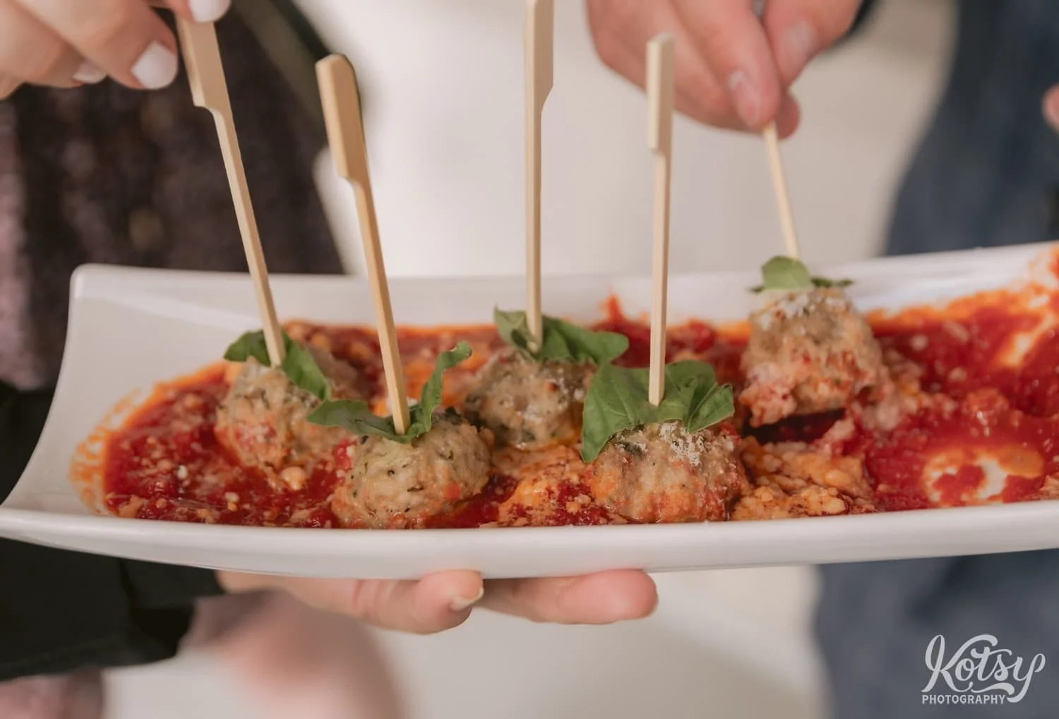 Close up shot of meatballs in red sauced at a Village Loft wedding reception in Toronto, Canada