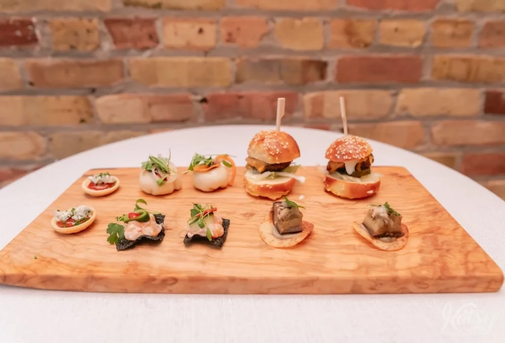 Some hors d'oeuvres are seen on a wooden cutting board at the Burroughes Building in Toronto